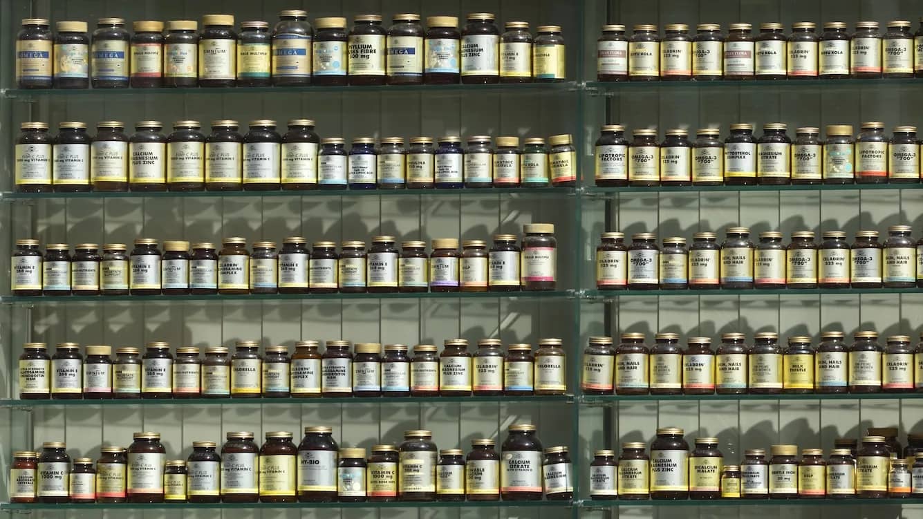 assorted labeled bottle on display shelf